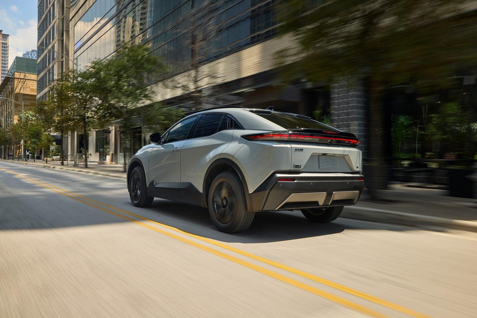 Toyota C-HR EV 2026 — экстерьер, rear 3q white, рынок US / EU reference