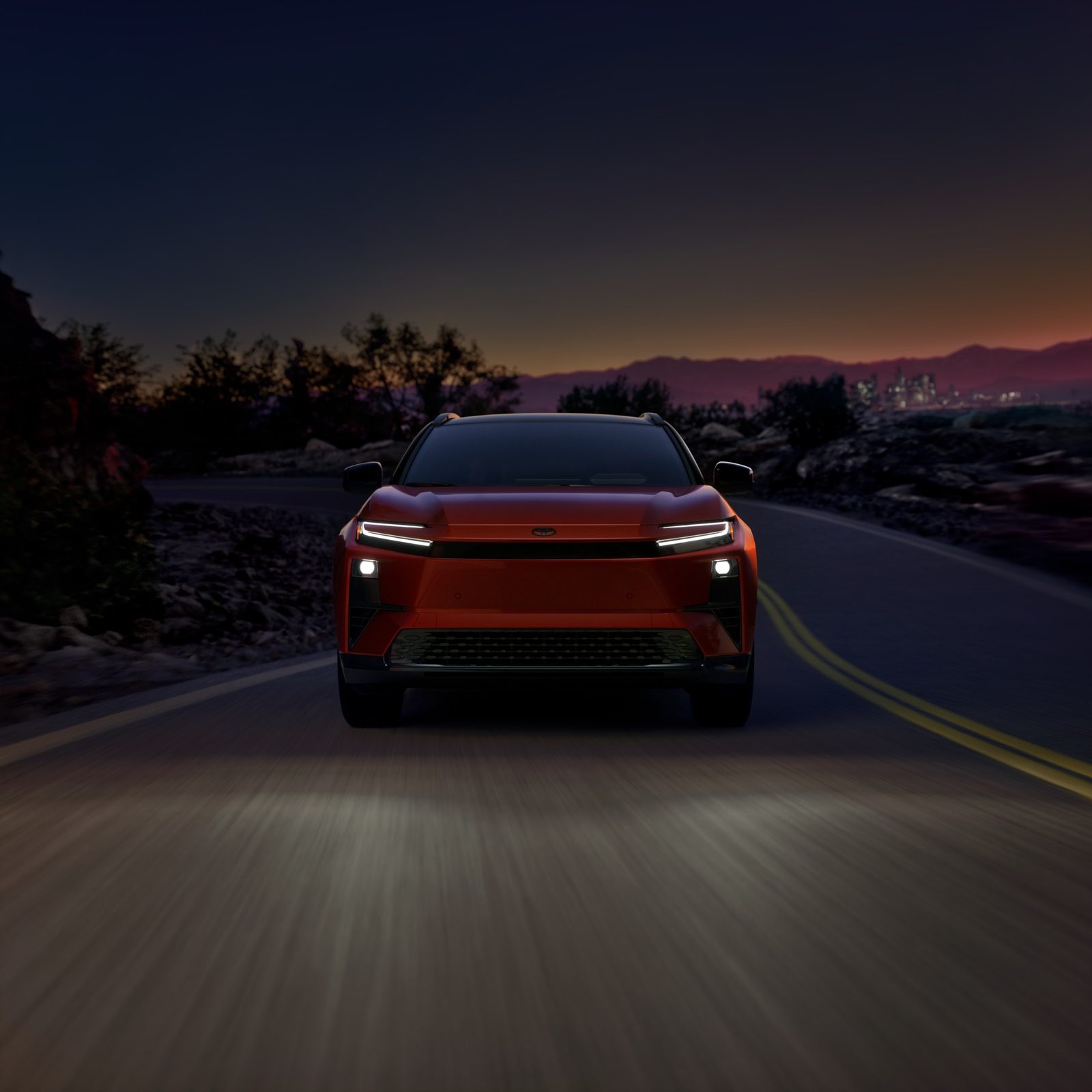 Toyota C-HR EV 2026 — экстерьер, front 3q night, рынок US / EU reference
